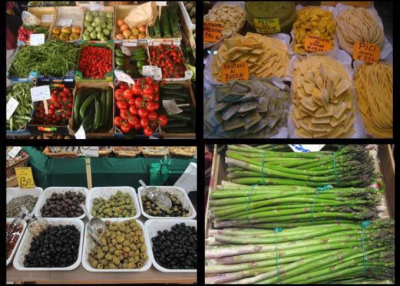 Food choices inside a Florence Italy street market: olives, tomatoes, asparagus, peppers, beans and pasta of many varieties