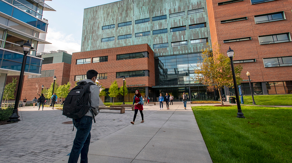 Students walking to and from the School of Pharmacy building on Oct. 3, 2018. (Sean Flynn/UConn Photo)