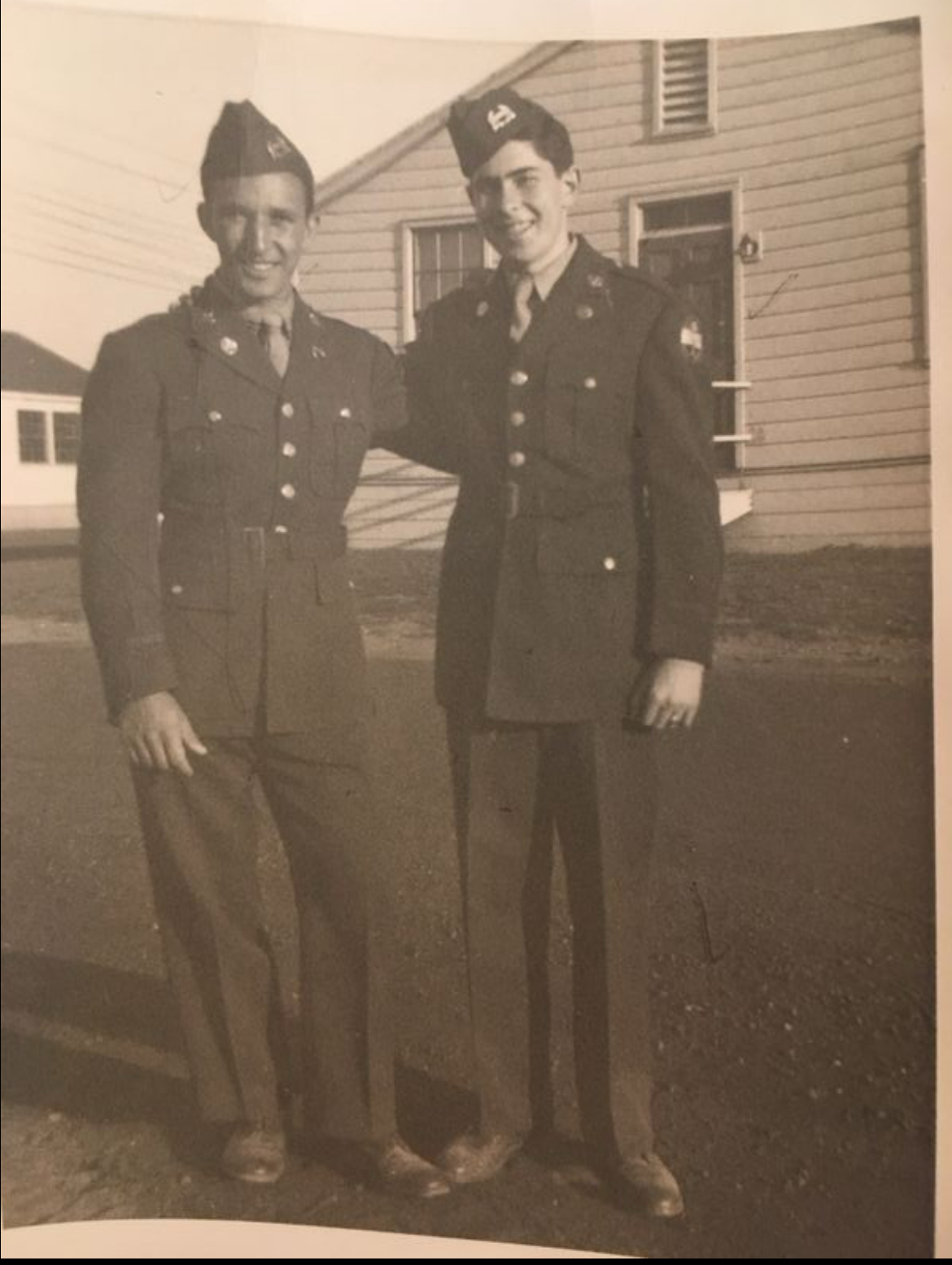 Kenneth Burack and Milton Lurie, Alpha Zeta Omega fraternity brothers, in ROTC uniforms taken in front of Quads housing in 1951